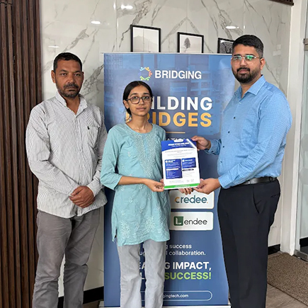 A HungerPods staff member handing a scholarship certificate to a student